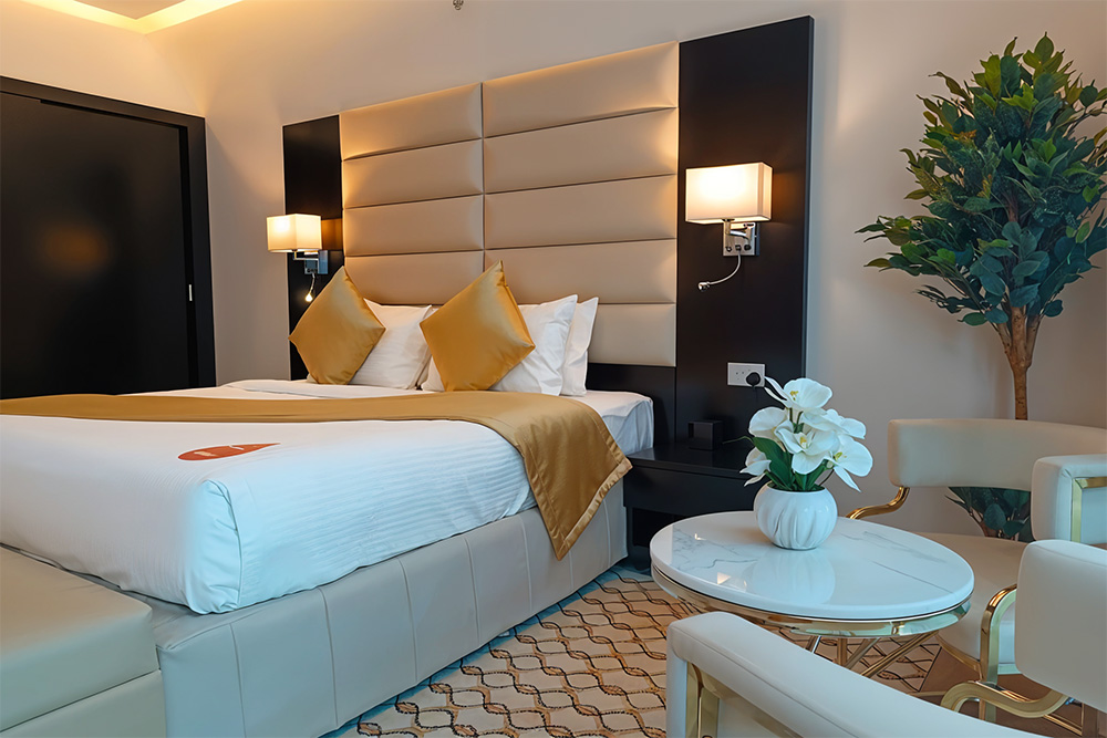 a deluxe room at emirates grand hotel