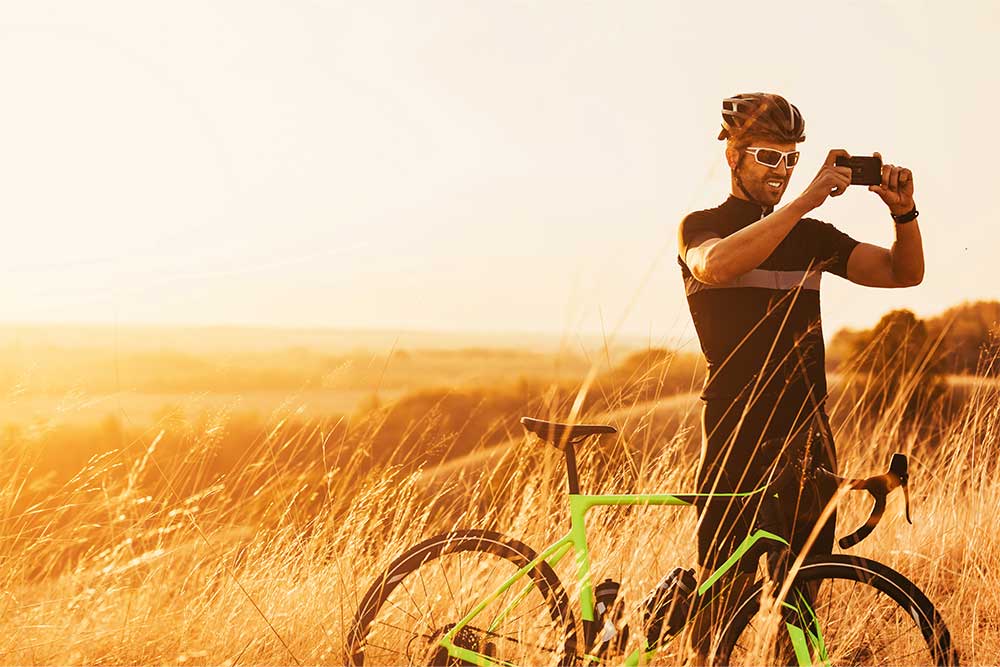 Cyclist taking pictures on the track