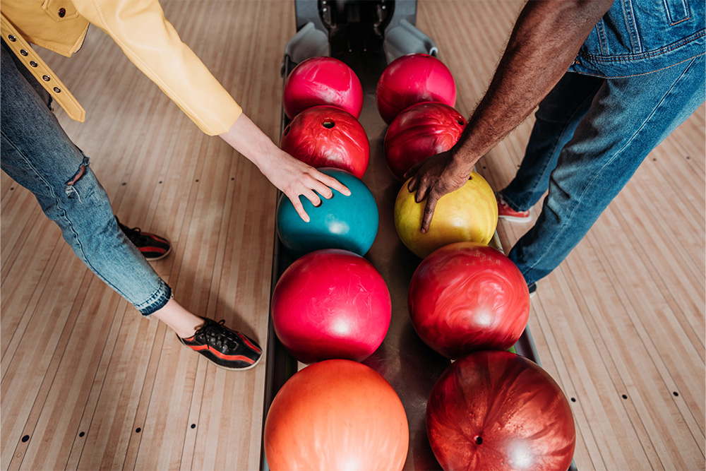  challenging each other to a bowling match