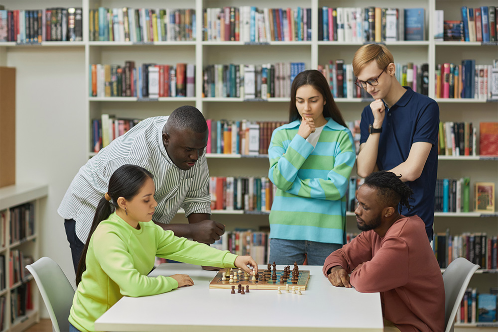 Group people playing and watching chess