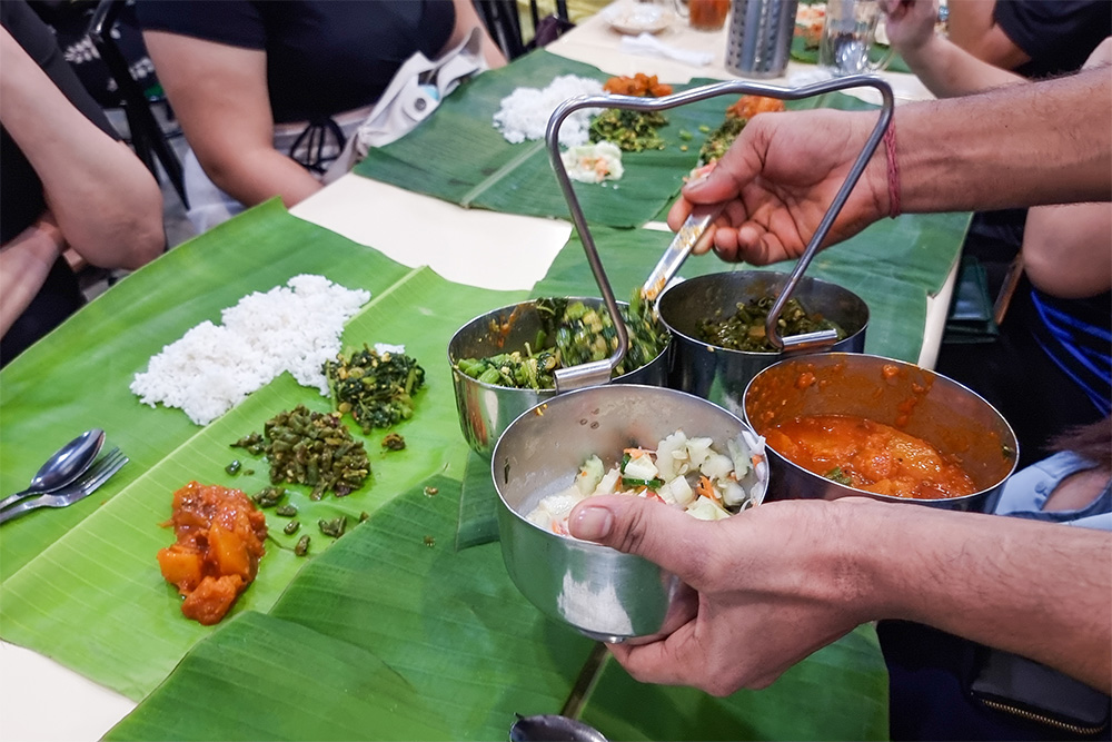 People serving Kerala food