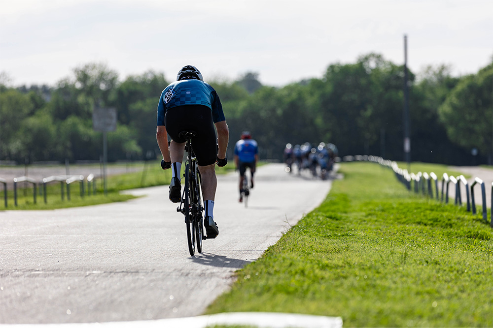 A cyclist riding on a sunny day