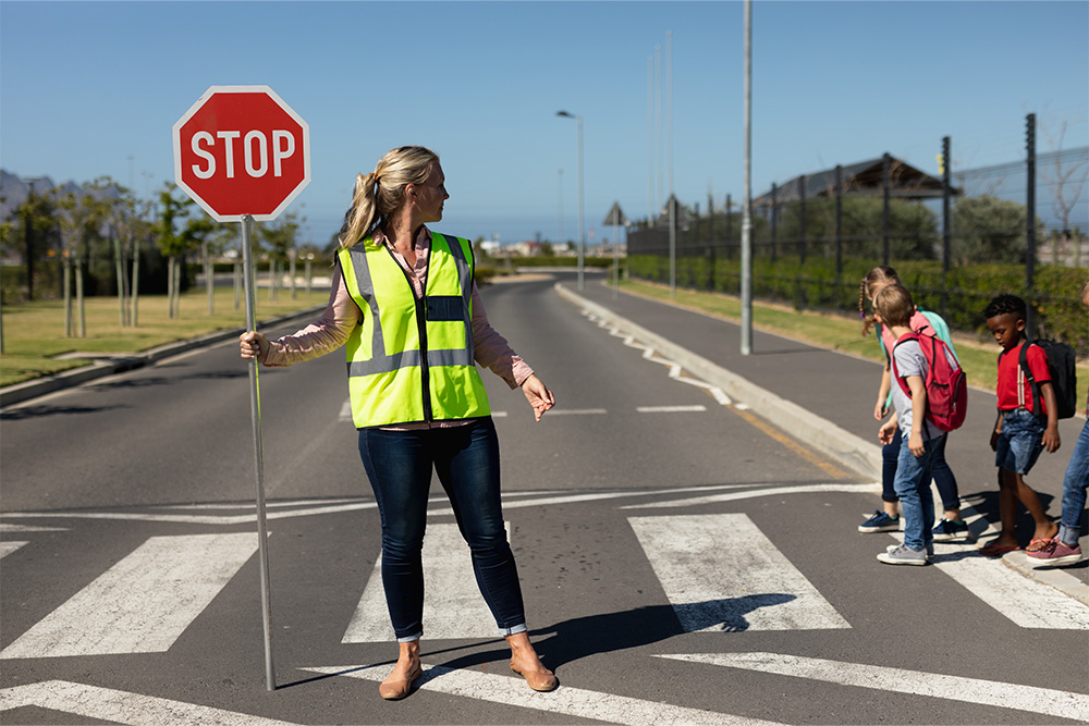 Woman stopping traffic