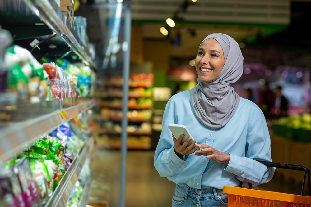 A woman searching for pet food at a store in Dubai 