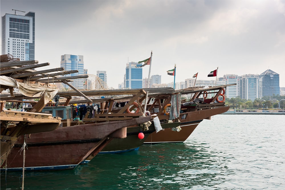 Old fishing boats with rusty metal nets in the Persian Gulf