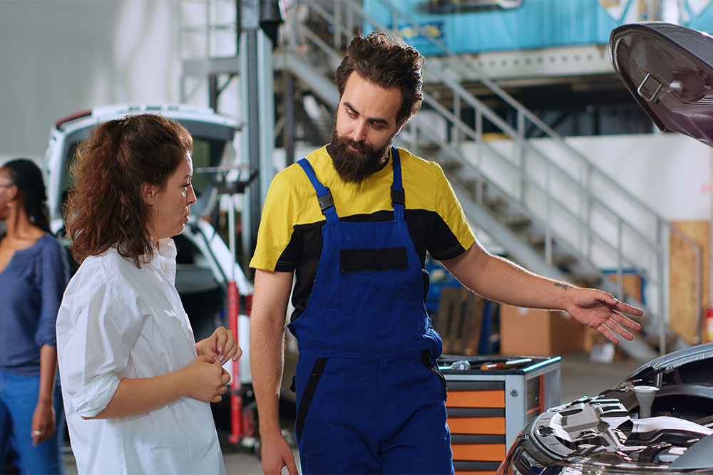 Consulting with a garage worker in Abu Dhabi