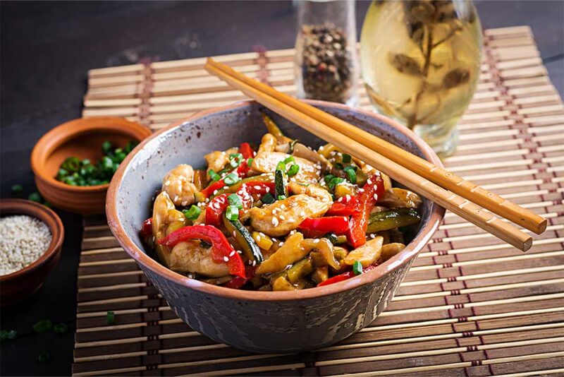 Try fry chicken with chopsticks in a Chinese restaurant in Sharjah