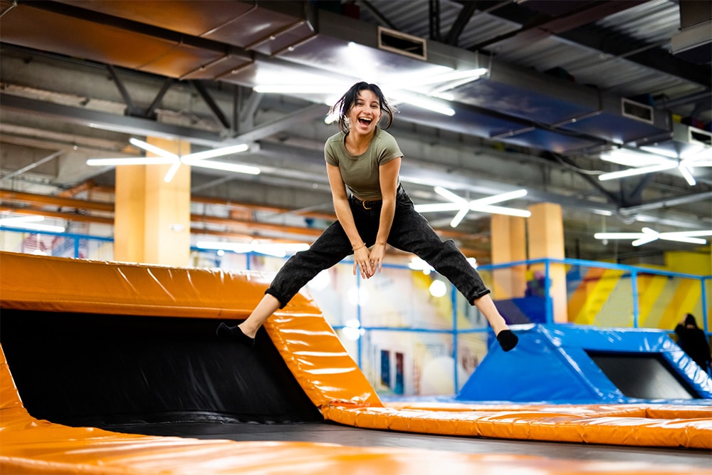 girl having fun at jump boxx indoor trampoline park