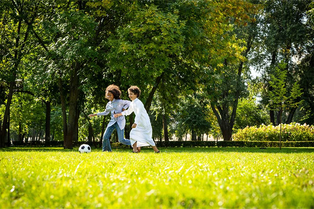 playing football in Al Jurf Family Park