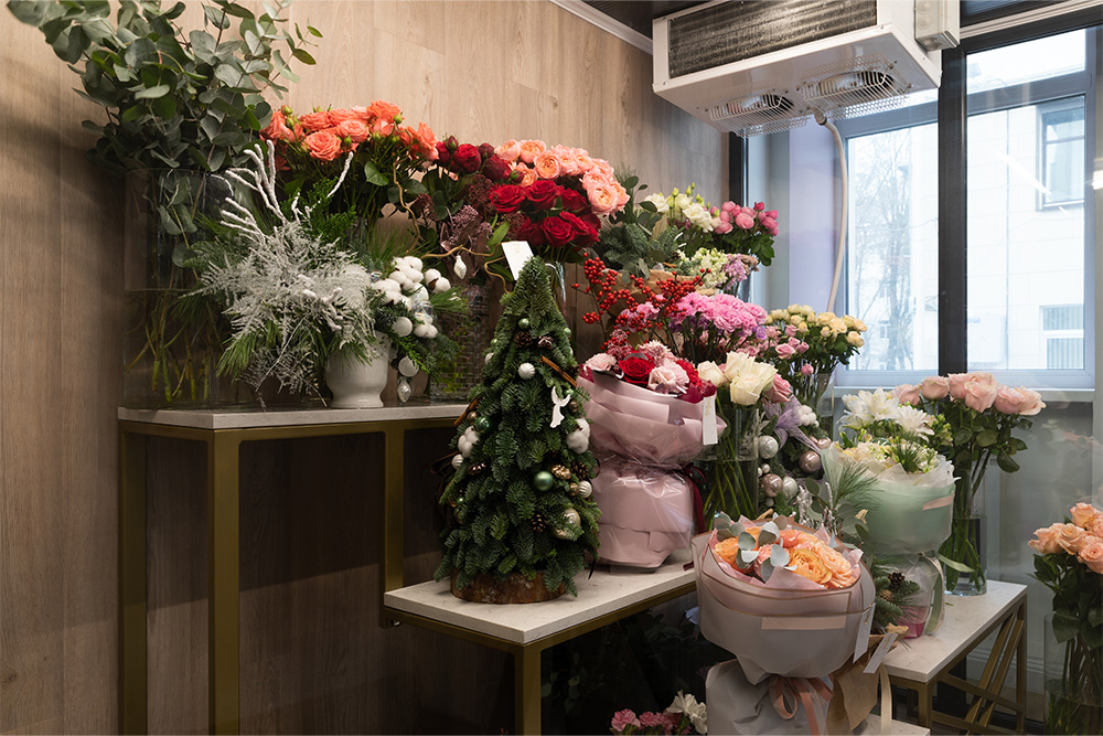 Flower Bouquets displayed on a shelf 
