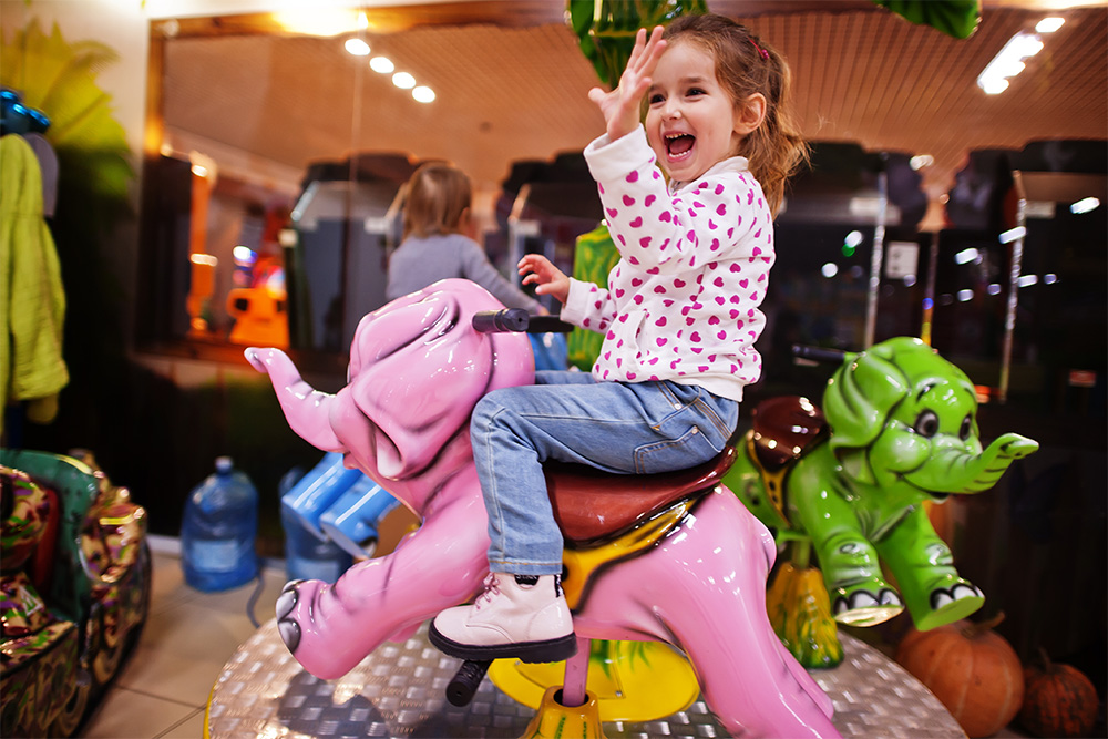 enjoying a kiddie ride 