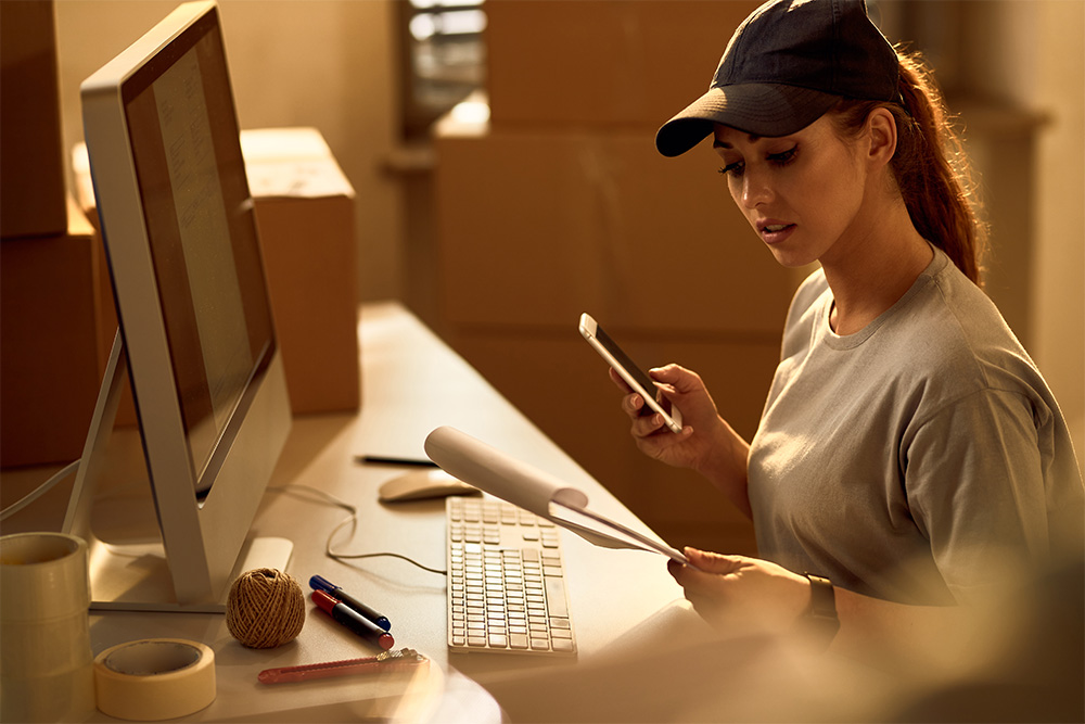 Delivery woman going through dispatch list 