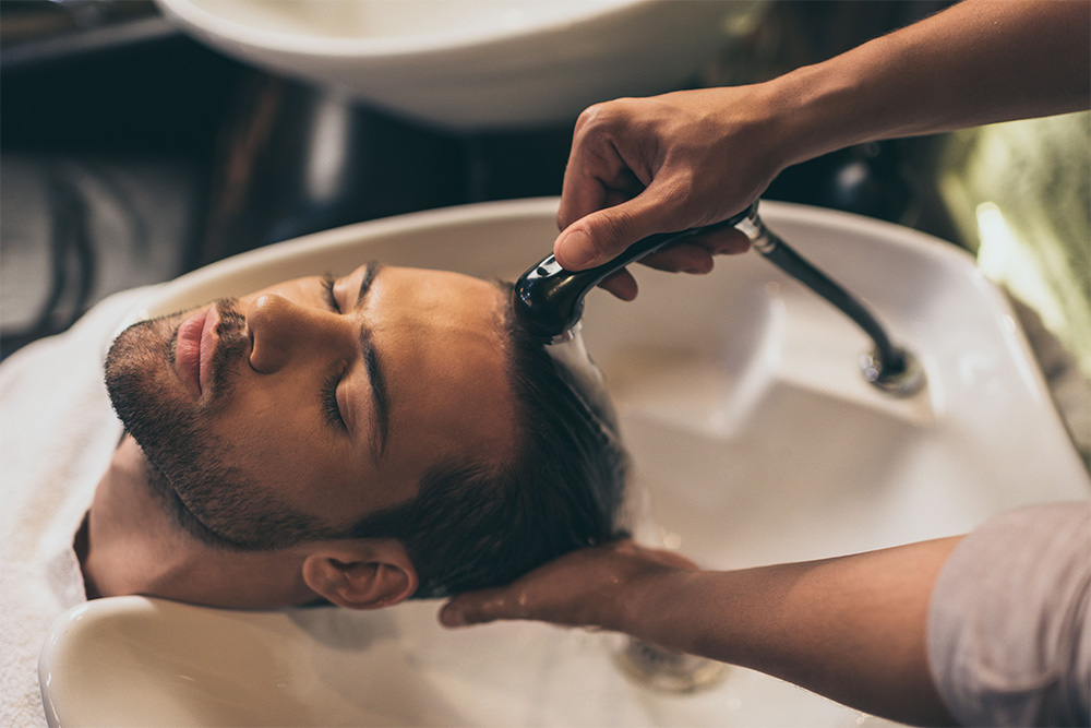 Hair wash at one of the best barber shops in Sharjah