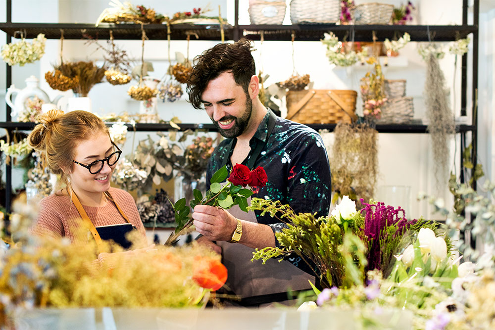 Florists arranging a bouquet in a flower shop