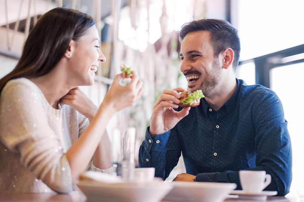 couple enjoying breakfast at a french restaurant 