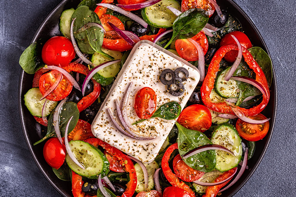  a bowl of Greek Salad served in an Abu Dhabi Greek restaurant