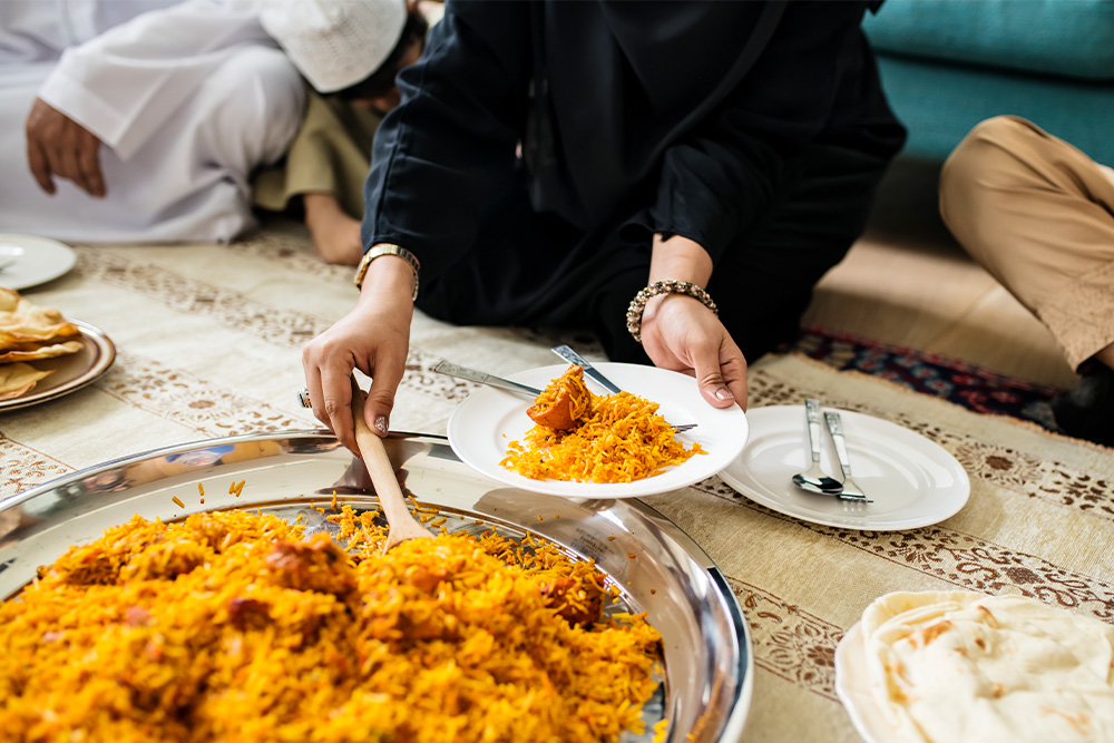 Family having popular Pakistani food; Chicken Biryani