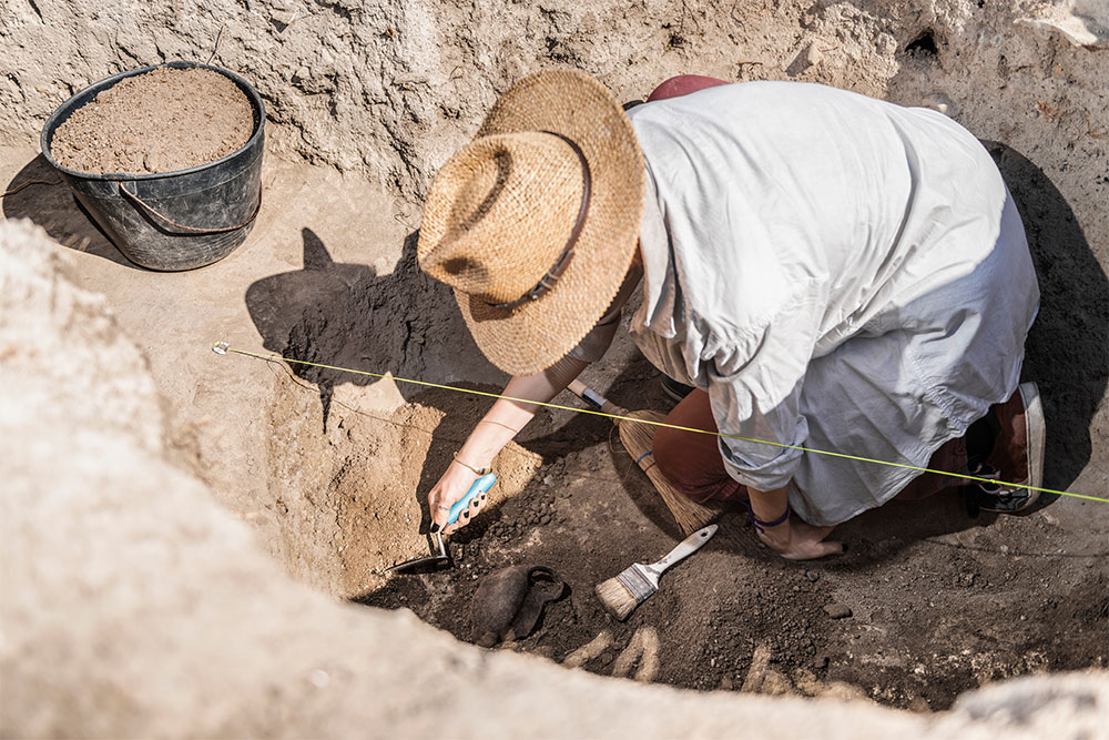 Archaeologist Uncovering Artefacts at Jumeirah Archaeological Site