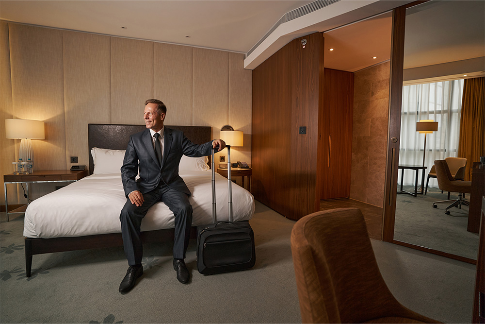 A businessman enjoying his stay in a hotel in Mirdif