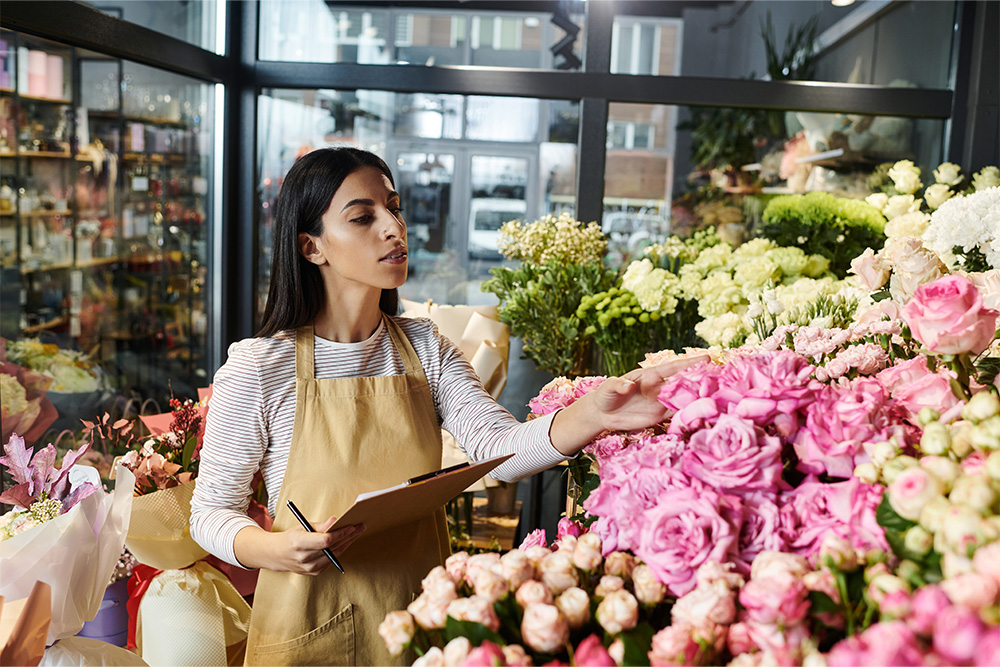 arranging flowers in flower shop