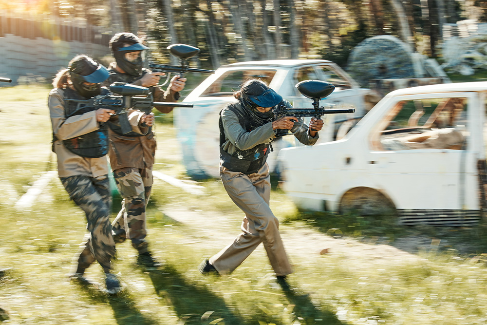 A team dressed in uniforms for a paintball match 