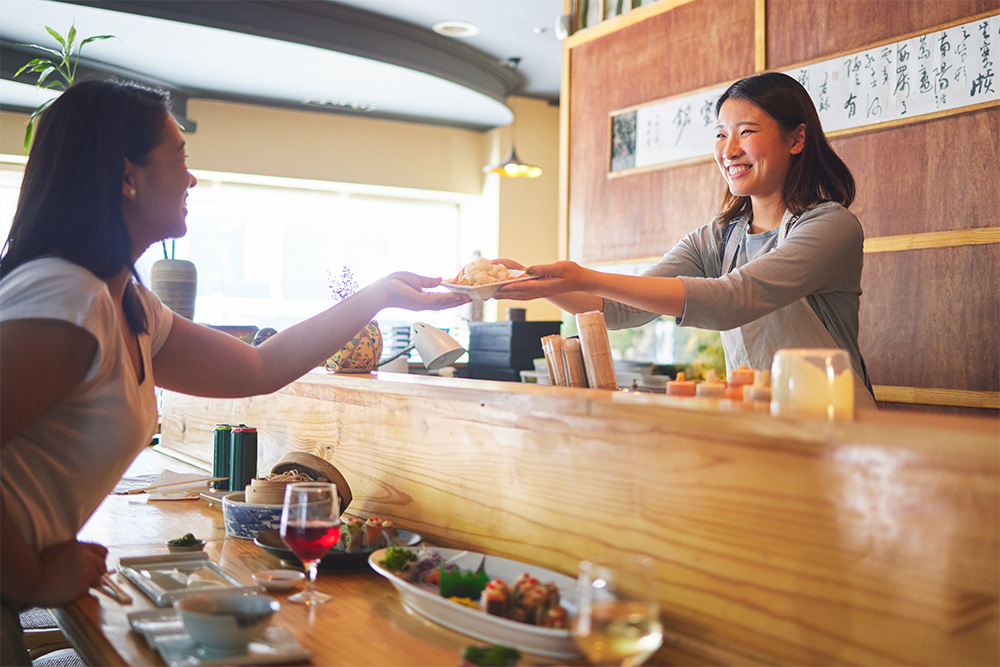 Taking food from a restaurant counter 