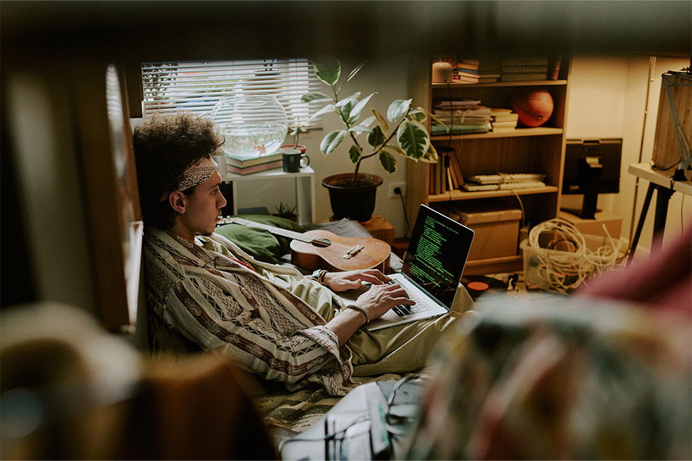 A couple lounging in a studio apartment 