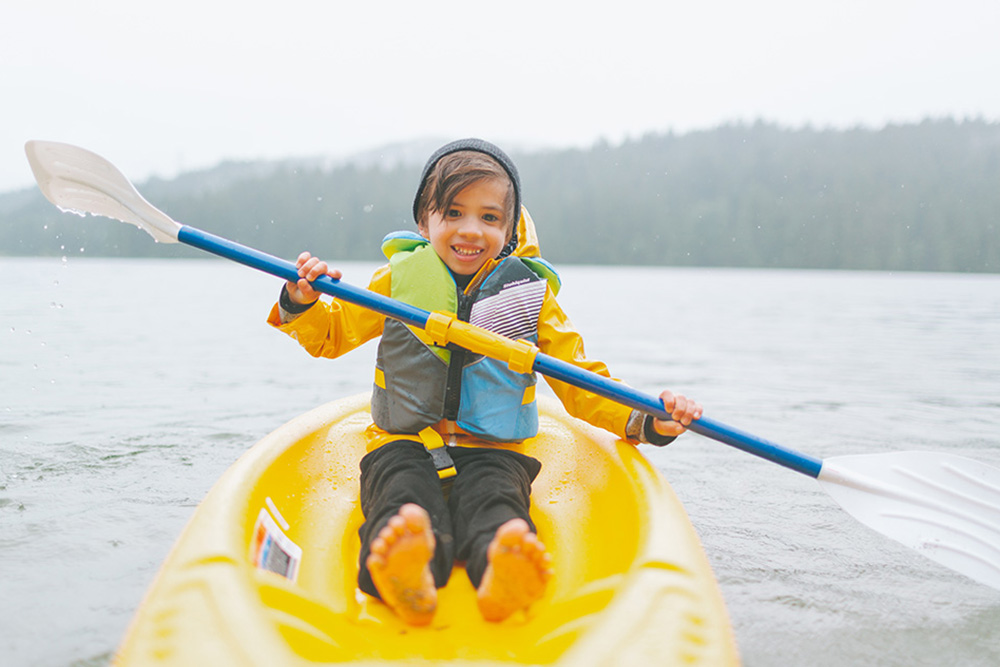 Paddling happily on a kayak