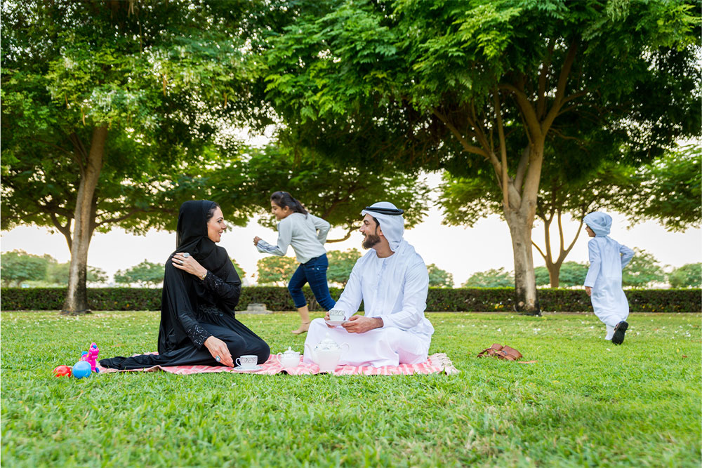 A family enjoying a picnic in the lush gardens 