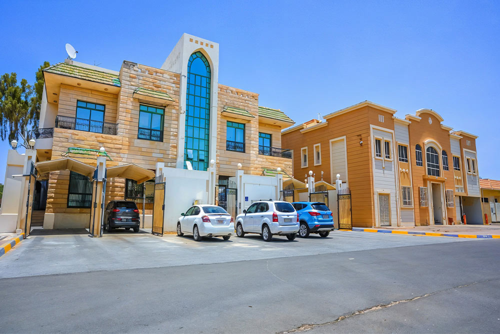 Cars parked in parking space in Ain Al Faydah