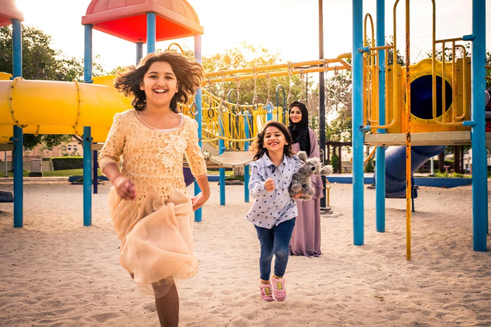 kids enjoying at a park play area 