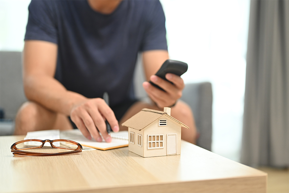 A homeowner managing his house remotely using the Dubai Police mobile application 