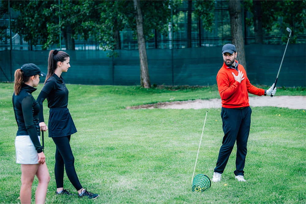 Golf instructor showing a swing technique