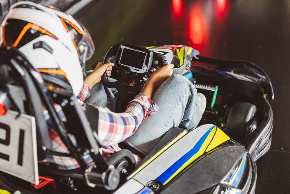 steering the wheel of a kart