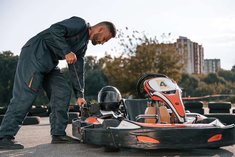 prepping a go-kart before boarding it 