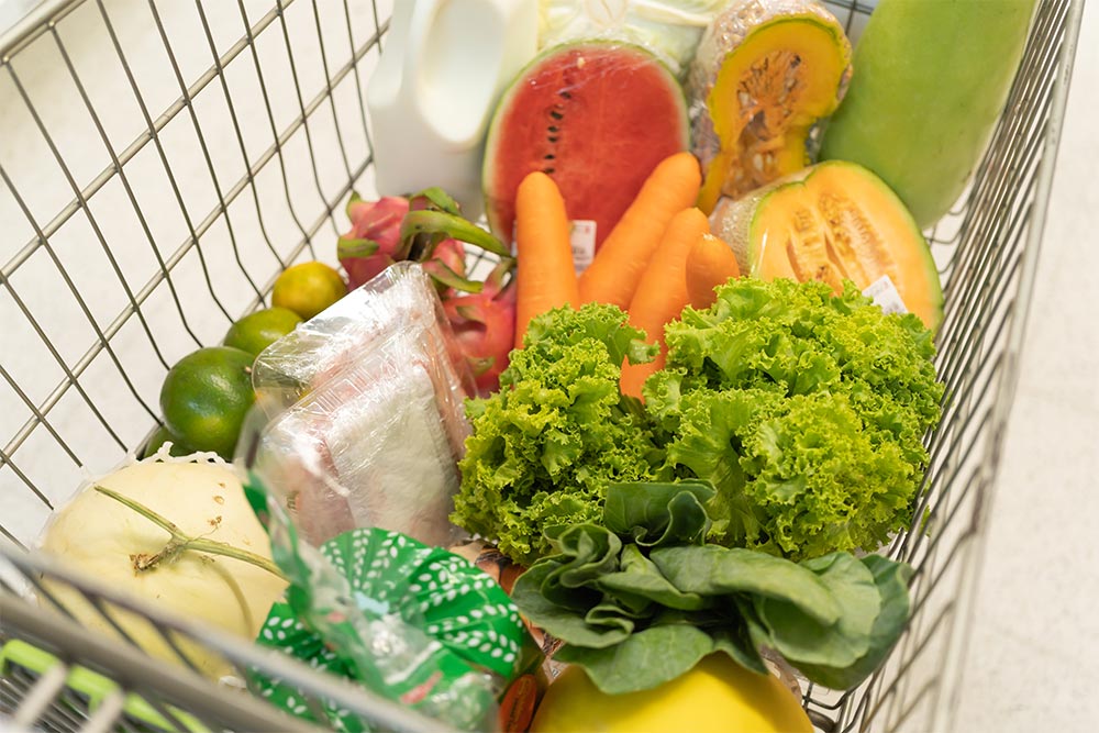 A shopping cart filled with groceries 