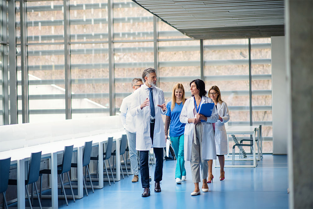 A group of doctors walking in the corridors of a hospital 