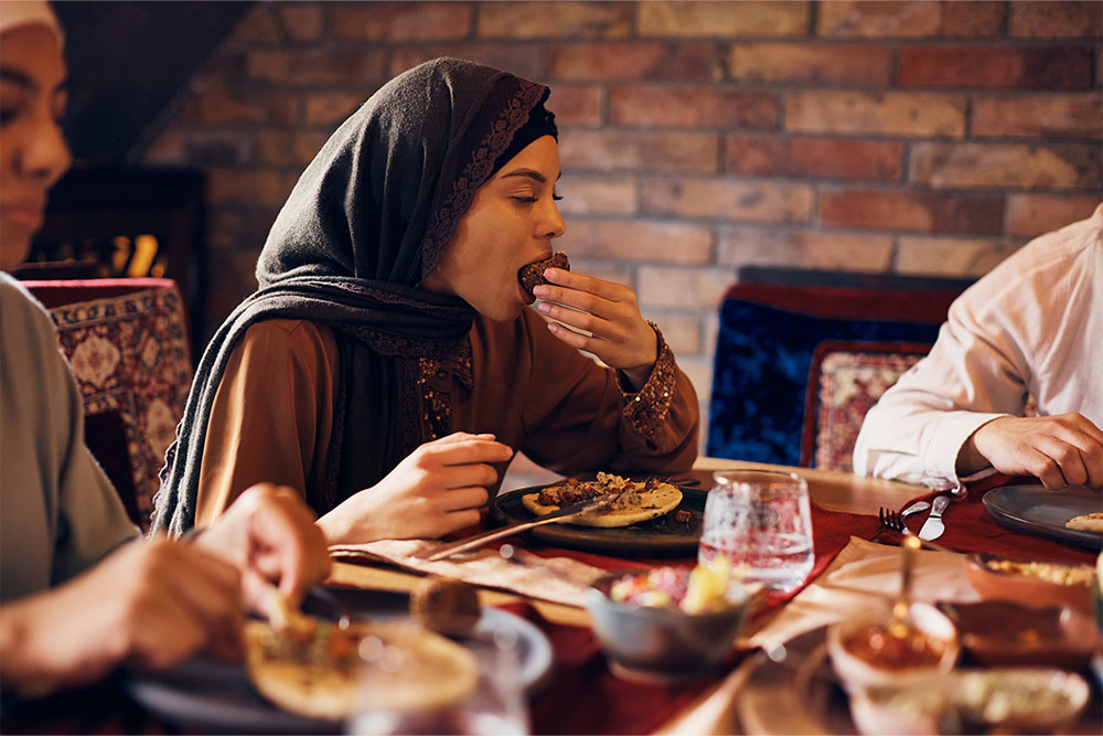 A girl enjoying falafel at a Lebanese restaurant in Ras Al Khaimah