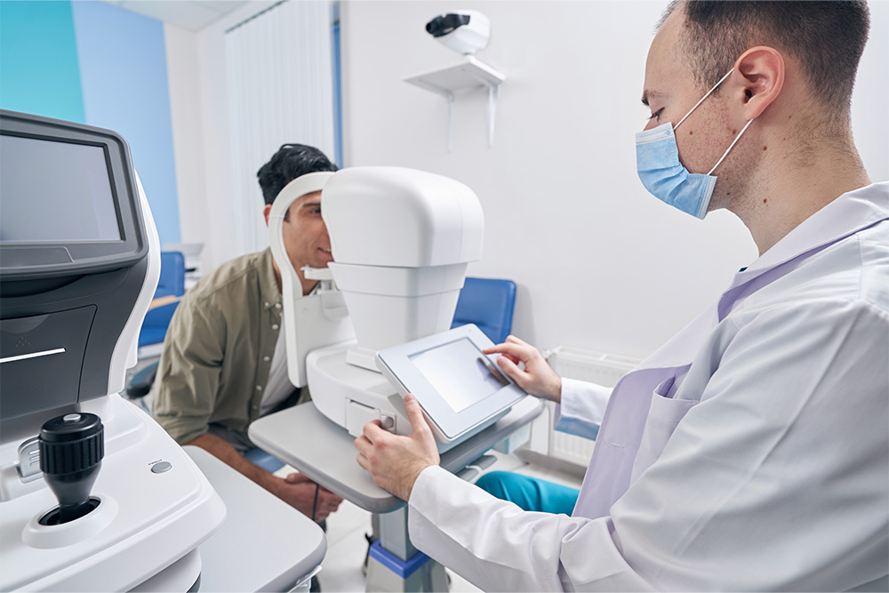 An ophthalmologist studying the results 