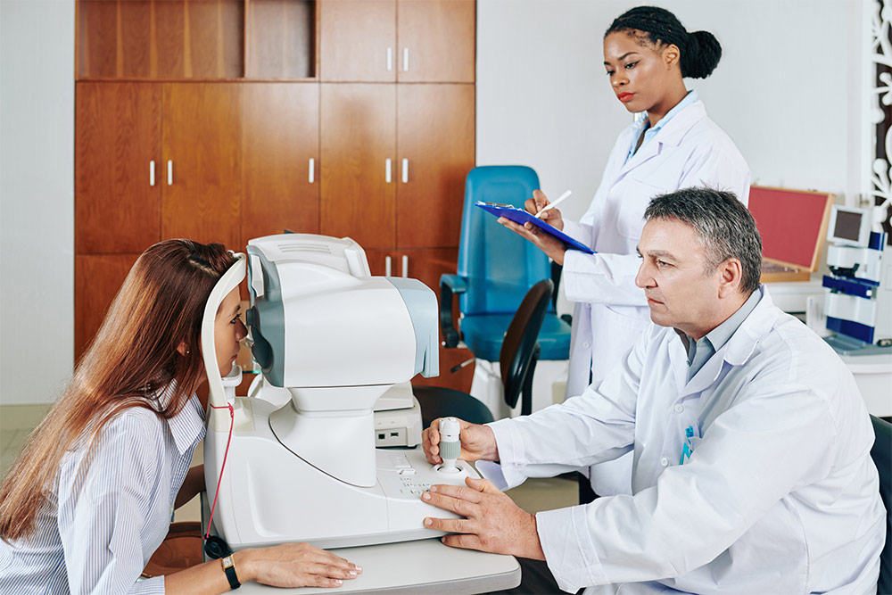 ophthalmologists examining a patient’s eyes 