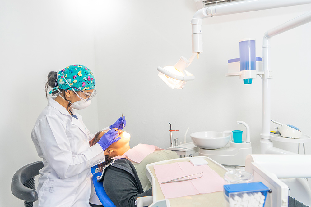 A female dentist examining a patient at Health Family Dental Clinic in Bur Dubai 