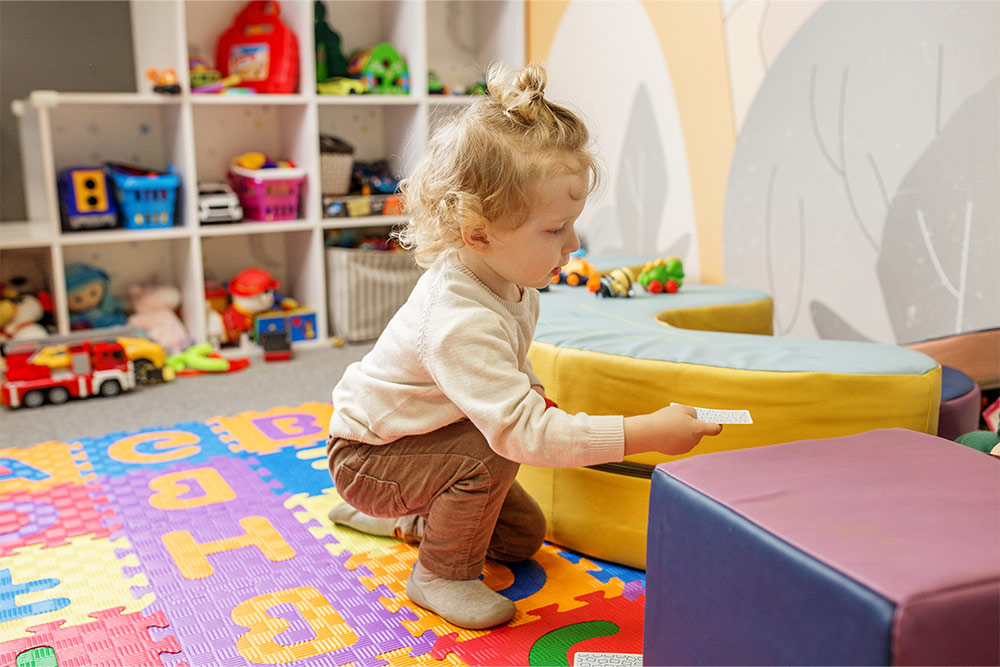 Toddler engaged in an educational game