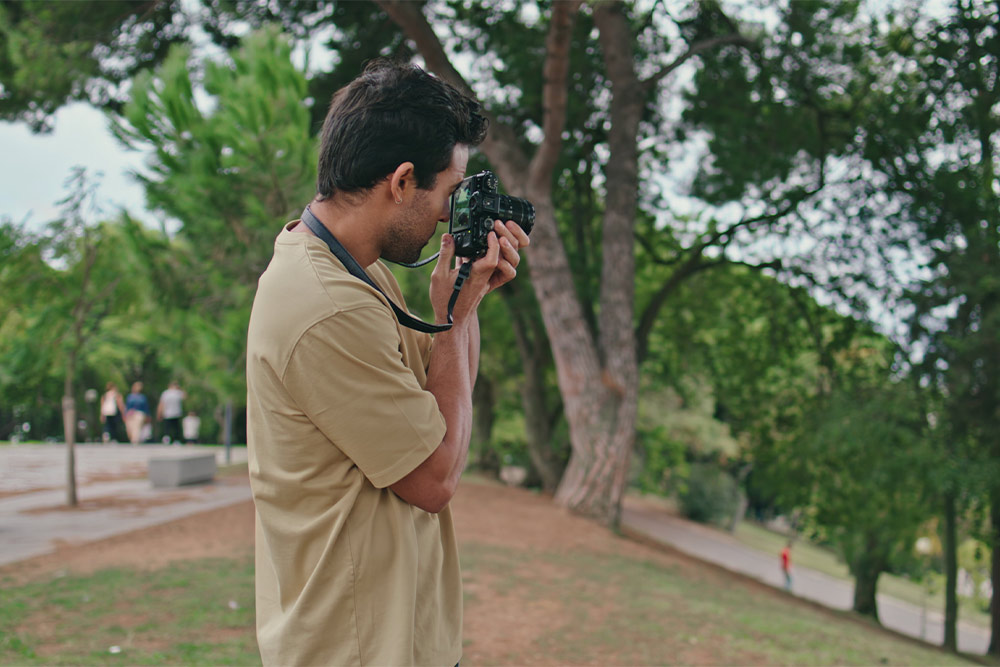 A man clicking photographs of scenic views