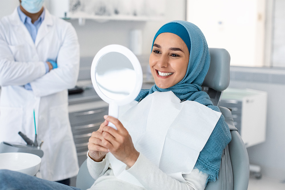 A woman satisfied with her dental treatment at Kings Dental Centre 