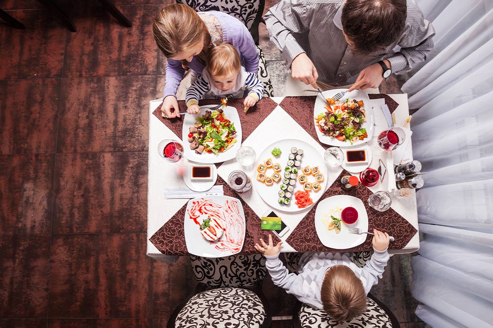 A family enjoying a meal at a restaurant