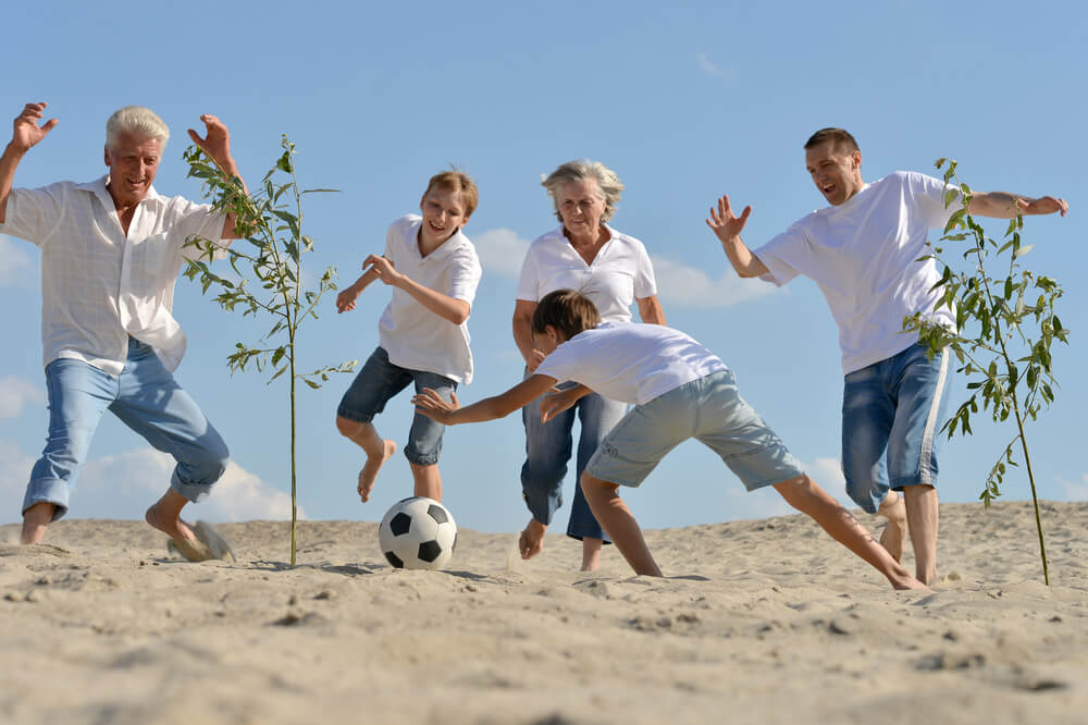 playing football at beach