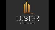 LUSTER REAL ESTATE L.L.C logo image