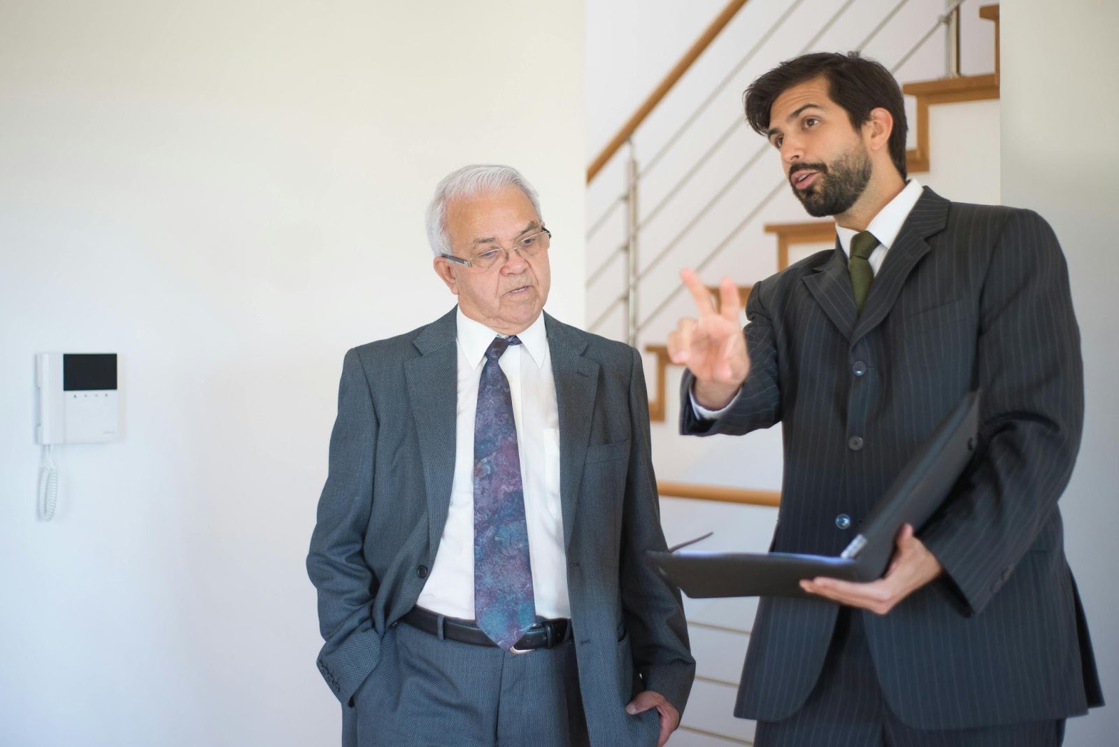 A Realtor Explaining Home features to an Elderly Man