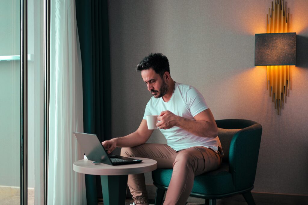 A person managing a client database on a computer, representing effective data organization and analysis.