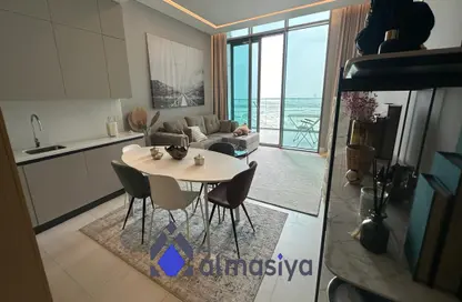 Living / Dining Room image for: Duplex - 1 Bedroom - 2 Bathrooms for sale in SLS Dubai Hotel  and  Residences - Business Bay - Dubai, Image 1